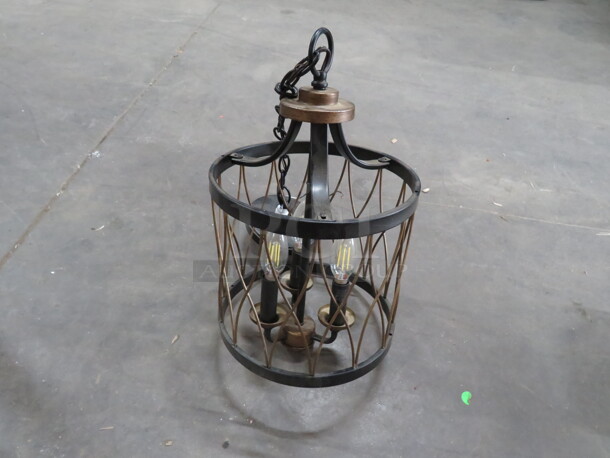One Brown Metal Pendant Light Fixture With 3 Lights.