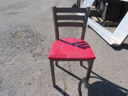 Brown Metal Chair With A Red Poly Seat. 2XBID