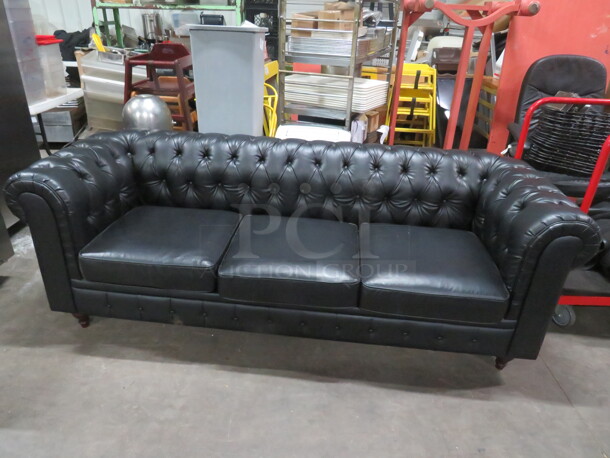 One Black Pleather Couch. 88X35X30 - Image 1 of 2