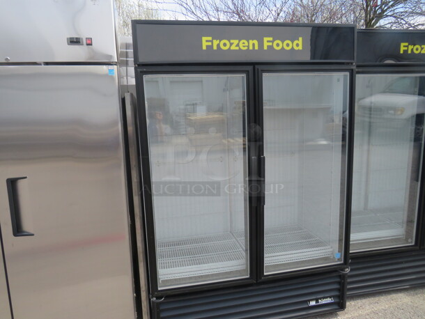 One TRUE 2 Door Glass Door Freezer With 8 Racks. Model# GDM-49F. 115/208-230 Volt. 1 Phase. 54X30X79.