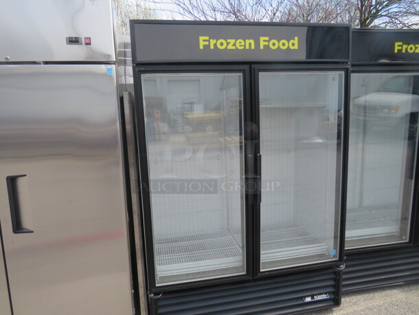 One TRUE 2 Door Glass Door Freezer With 8 Racks. Model# GDM-49F. 115/208-230 Volt. 1 Phase. 54X30X79. - Image 1 of 3