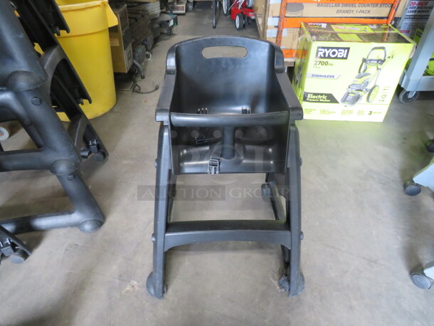 One Black Poly High Chair With Safety Straps, On Casters.