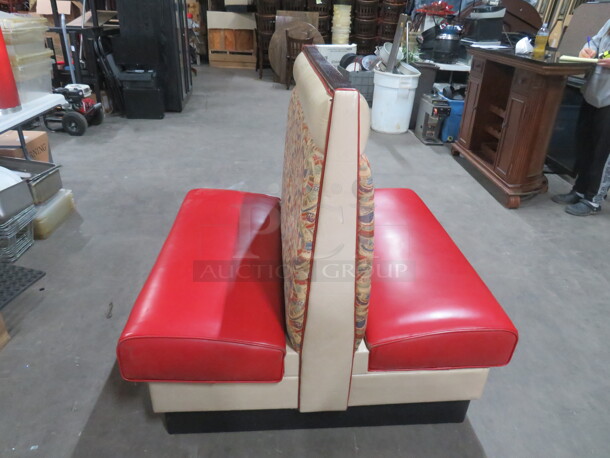 One Double Sided Booth With Red Cushioned Seat And Multi Colored Back. 47X48X45.5