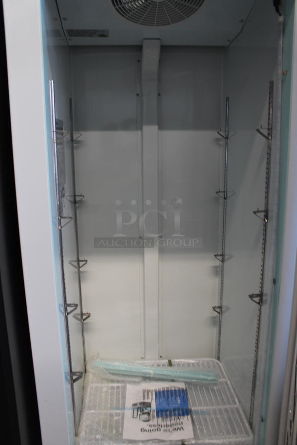 BRAND NEW SCRATCH AND DENT! 2023 Avantco 178GDC12FHCW Metal Commercial Single Door Reach In Freezer Merchandiser w/ Poly Coated Racks on Commercial Casters. See Pictures For Broken Glass and Bottom Dent. 115 Volts, 1 Phase. Tested and Working! - Image 5 of 6