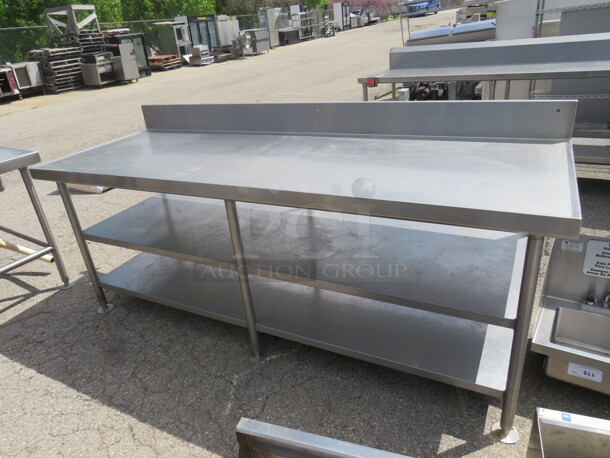 One Stainless Steel Table With 2 Stainless Steel Undershelves, And Back Splash. 90X32X40