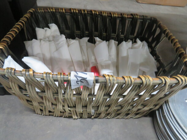 One Basket Full Of Wrapped Flatware.