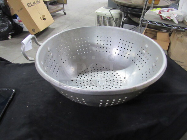 One 16 Inch Aluminum Colander.