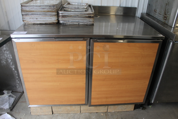 Duke SUBP-48 M Stainless Steel Commercial Counter w/ 2 Wood Pattern Doors and Back Splash.  - Image 1 of 4
