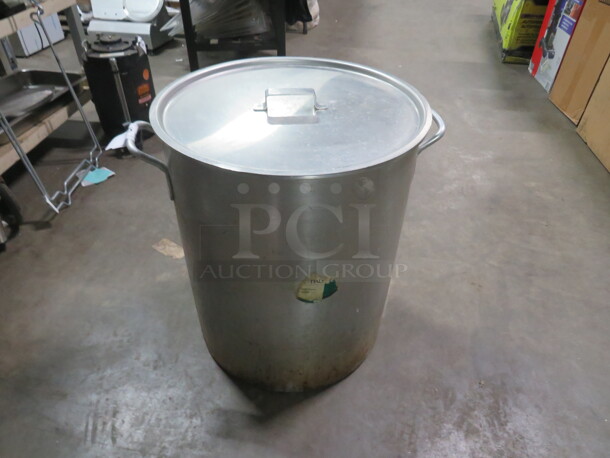 One 80  Quart Aluminum Stock Pot With Steamer Basket And Lid..