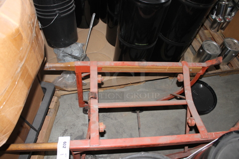 Orange Metal Barrel Cradle.