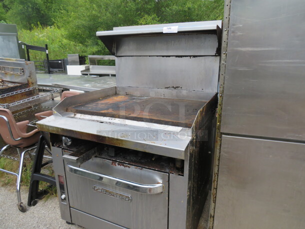 One Southbend Flattop Range With Stainless Steel Overshelf On Casters. Missing 2 Knobs, And Front Panel. 36X38X60 - Image 2 of 2