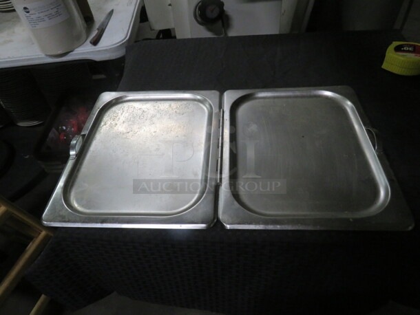 One Full Size Stainless Steel Hinged Lid.