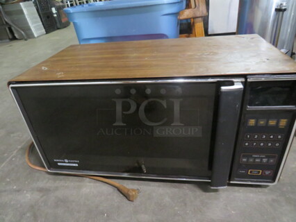 One General Electric Microwave. 23X12X12