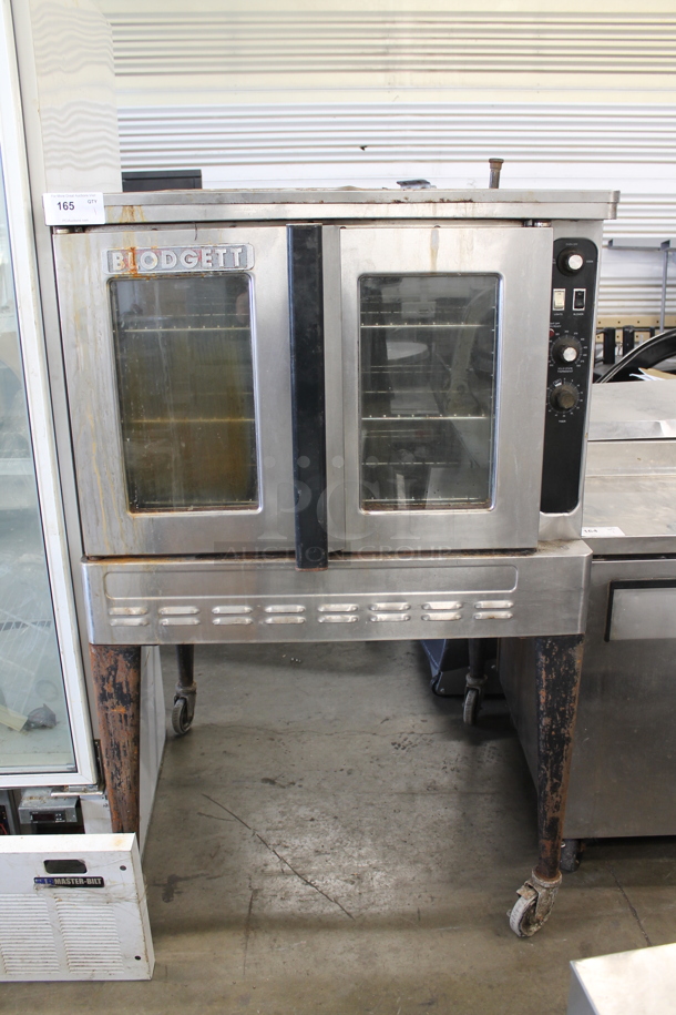 Blodgett Stainless Steel Commercial Natural Gas Powered Full Size Convection Oven w/ View Through Doors, Metal Oven Racks, Thermostatic Controls and Metal Legs on Commercial Casters. - Image 1 of 5