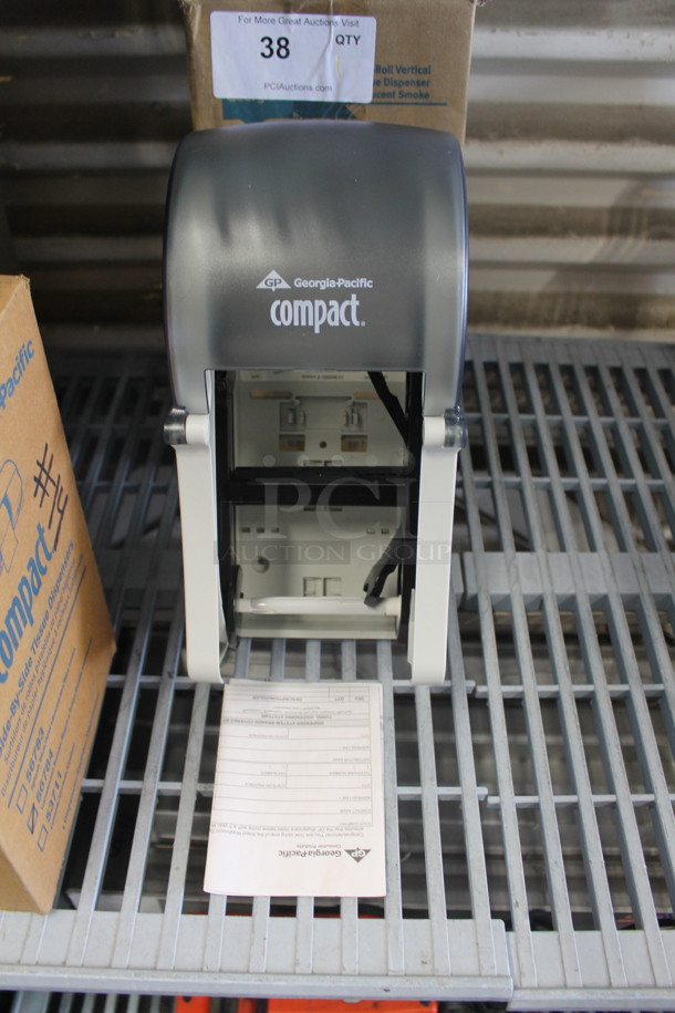 BRAND NEW IN BOX! Georgia Pacific Compact Poly Toilet Paper Dispenser.  - Image 1 of 3