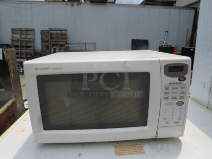 One Sharp Carousel Microwave. Model# R303CW. 115 Volt. 20.5X16X12