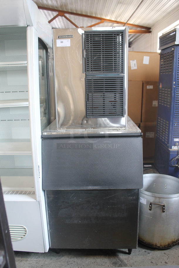 Hoshizaki Commercial Stainless Steel Electric Ice Machine With Storage Bin On Black Legs. 