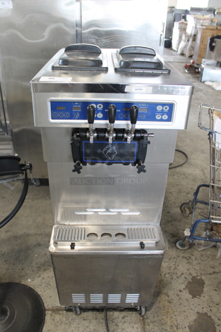 SSI-203S Stainless Steel Commercial Air Cooled Floor Style 2 Flavor w/ Twist Soft Serve Ice Cream Machine on Commercial Casters. 220 Volts, 1 Phase.