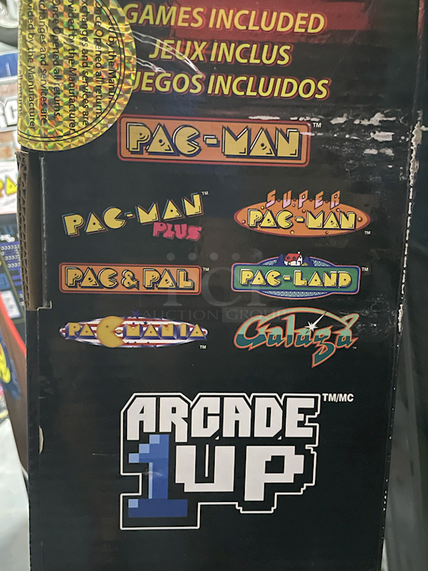 Arcade1UP 40th Anniversary Pac Man At Home Arcade. Games: Pac-Man, Pac-Man Plus, Pac & Pal, Pac-Land, Pacmania, Galaga, Super Pac-Man. Included In The Box: Arcade Cabinet (45.8" H) • 17" LCD Screen • Controller Deck With Preassembled Buttons • Deck Protector • Power Adapter • Instruction Manual - Image 3 of 4