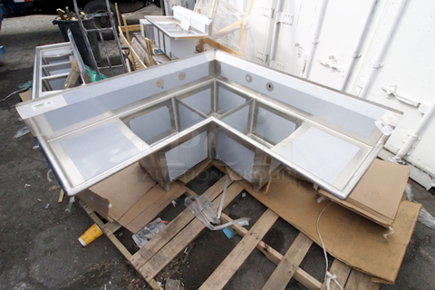 BRAND NEW SCRATCH & DENT! Regency 57" 16 Gauge Stainless Steel Three Compartment Commercial Corner Sink with 2 Drainboards - 18" x 18" x 14" Bowls