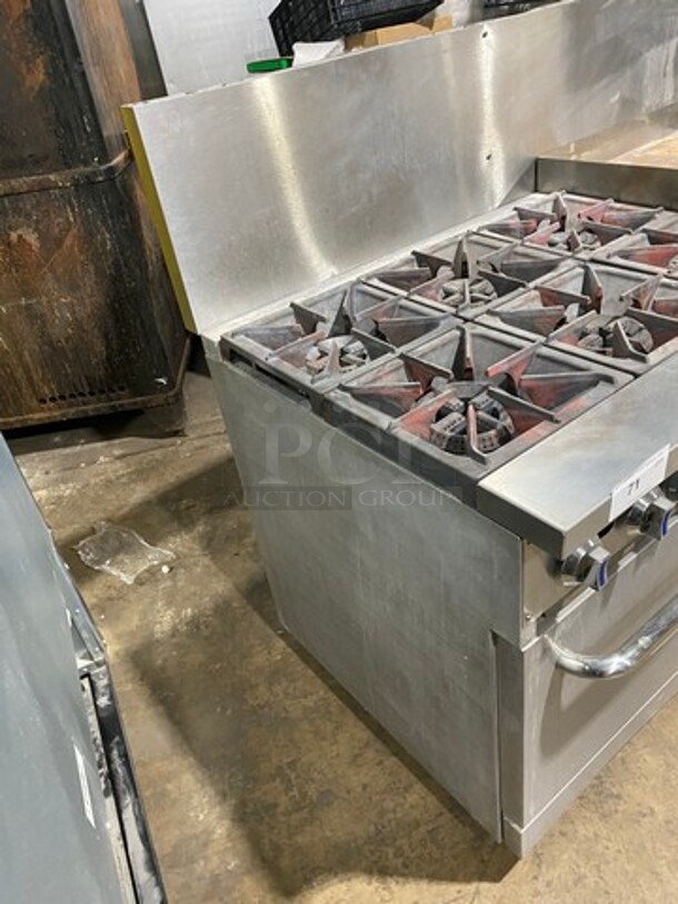 Patriot Commercial Natural Gas Powered 6 Burner Stove With Flat Griddle! Flat Griddle Has Side Splashes! With Raised Back Splash! With 2 Oven Underneath! Metal Oven Racks! All Stainless Steel! On Casters! WORKING WHEN REMOVED! - Image 3 of 12