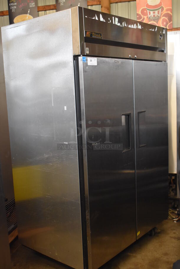 2012 True T-49F ENERGY STAR Stainless Steel Commercial 2 Door Reach In Freezer w/ Poly Coated Racks on Commercial Casters. 115 Volts, 1 Phase. Tested and Working!