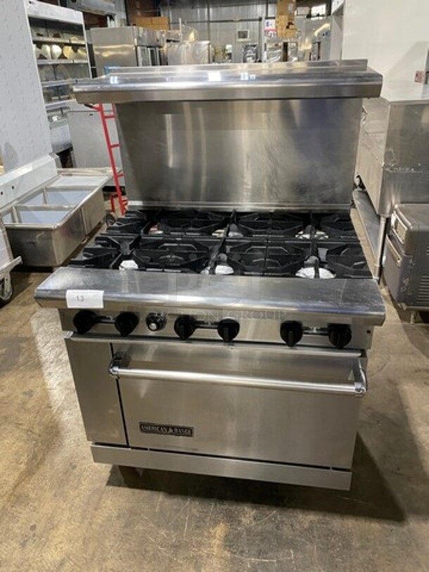 American Range Natural Gas Powered 6 Burner Stove! With Full Size Oven Underneath! With Raised Back Splash And Salamander Shelf! All Stainless Steel! On Casters! - Image 1 of 9