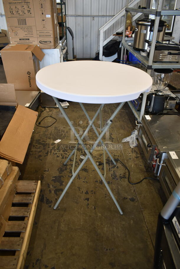 BRAND NEW SCRATCH AND DENT! Lancaster Table & Seating 384YCZ32RNDB White Round Folding Table. Stock Picture Used as Gallery.
