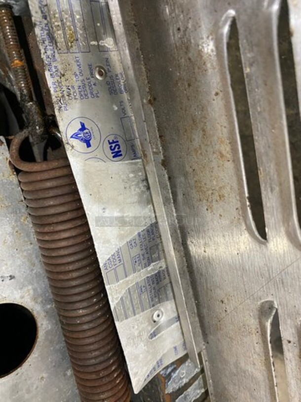 US Range Commercial Natural Gas Powered 4 Burner Stove With Built In Flat Grill! Flat Grill Has Side Splashes! With Raised Back Splash And Salamander Shelf! With Oven Underneath! All Stainless Steel! On Legs! - Image 9 of 10