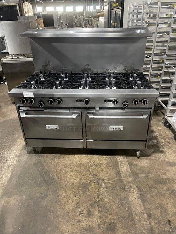 AMAZING! Garland Natural Gas Powered 10 Burner Stove! With 2 Standard Ovens Underneath! With Back Splash & Overhead Salamander Shelf! All Stainless Steel! On Casters! Model: G60-10RR! - Image 1 of 10