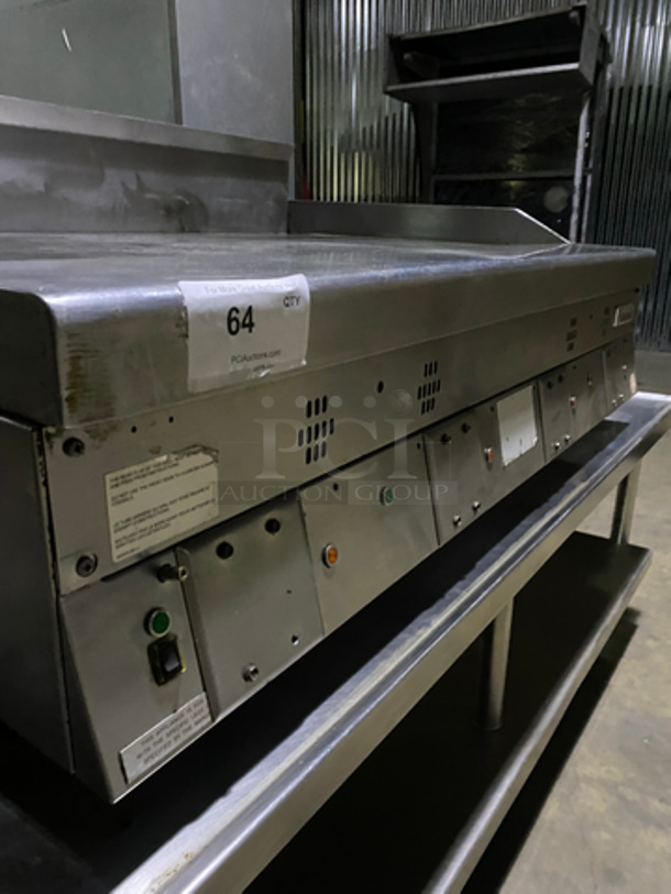 MUST HAVE! Garland Commercial Countertop Natural Gas Powered Heavy Duty Plancha Flat Grill! With Back And Side Splashes! On Heavy-Duty Stainless-Steel Equipment Stand! With Underneath Storage Space! On Casters! - Image 6 of 10