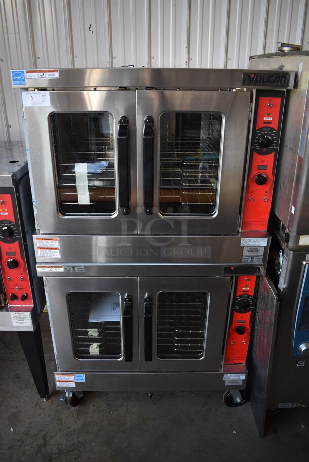 2 BRAND NEW SCRATCH AND DENT! LATE MODEL! Vulcan Model VC5GD-11D1Z Stainless Steel Commercial Natural Gas Powered Full Size Convection Oven w/ View Through Doors, Metal Oven Racks and Thermostatic Controls on Commercial Casters. 40x31x70. 2 Times Your Bid! Tested and Working!