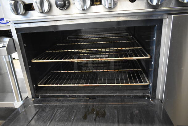 Cook Rite Stainless Steel Commercial Propane Gas Powered 6 Burner Range w/ Oven, Over Shelf and Back Splash on Commercial Casters.  - Image 6 of 7
