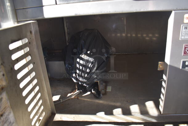 H. Ruiz 106 Stainless Steel Commercial Floor Style Wood Fired Grilled Chicken Rotisserie Oven on Commercial Casters. 59x38x66 - Image 9 of 11