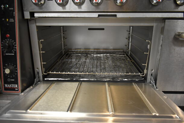 Cooking Performance Group CPG Stainless Steel Commercial Natural Gas Powered 10 Burner Range w/ 2 Ovens, Over Shelf and Back Splash on Commercial Casters. BUYER MUST REMOVE. Tested and Working! (kitchen) - Image 6 of 7