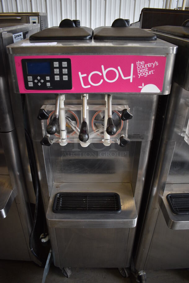 2013 Stoelting Model F231-309I2-AD1 Stainless Steel Commercial Floor Style Air Cooled 2 Flavor w/ Twist Soft Serve Ice Cream Machine on Commercial Casters. 208-240 Volts, 3 Phase.  - Image 1 of 7