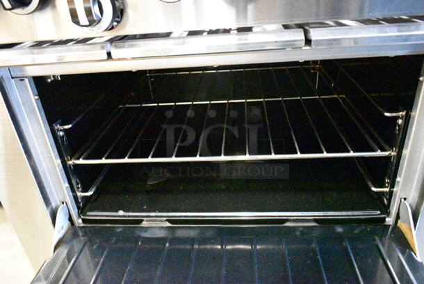 BRAND NEW SCRATCH AND DENT! 2024 Garland G36-6R Stainless Steel Commercial Natural Gas Powered 6 Burner Range w/ Oven, Over Shelf and Back Splash.  - Image 6 of 9