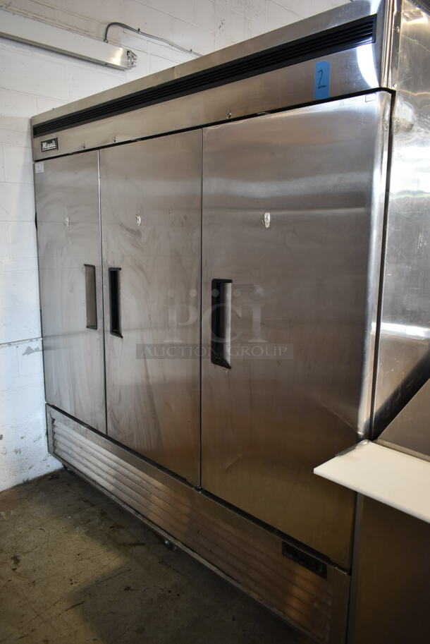 2020 Migali C-3FB-HC Stainless Steel Commercial 3 Door Reach In Freezer w/ Poly Coated Racks on Commercial Casters. 115/208-240 Volts, 1 Phase. Tested and Working! - Image 1 of 9