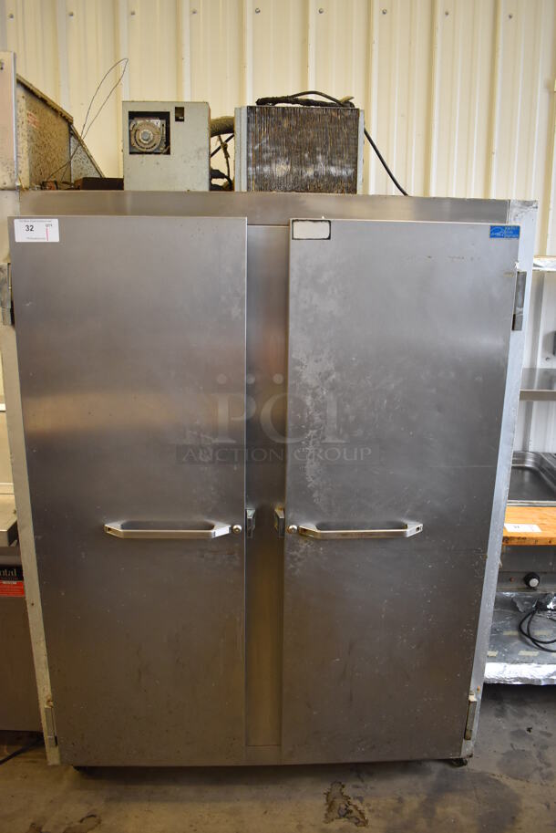 Continental 2F Stainless Steel Commercial 2 Door Reach In Freezer w/ Poly Coated Racks on Commercial Casters. 115 Volts, 1 Phase. 52x34x82. Tested and Working!