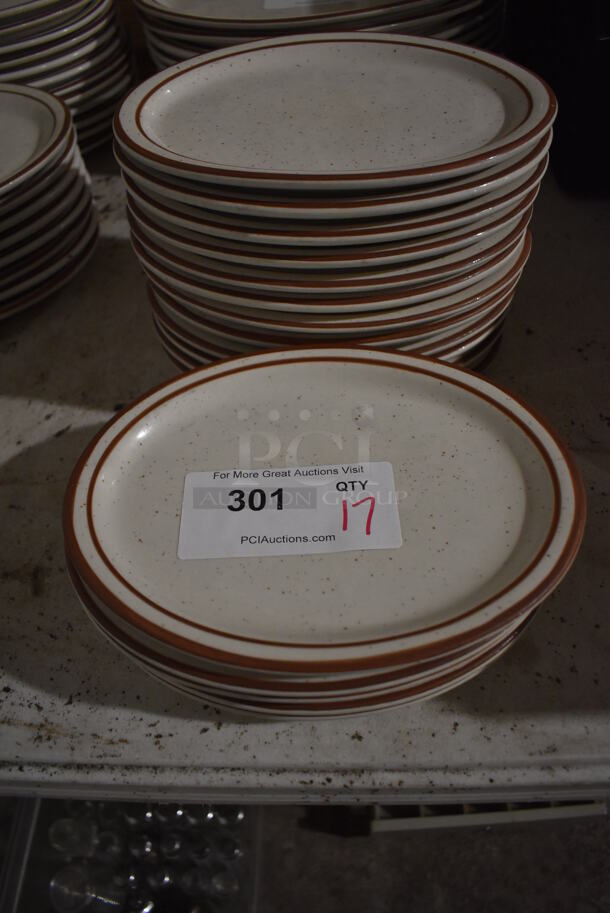 17 White Ceramic Oval Plates w/ Brown Lines on Rim. 9.5x7.5x1. 17 Times Your Bid!
