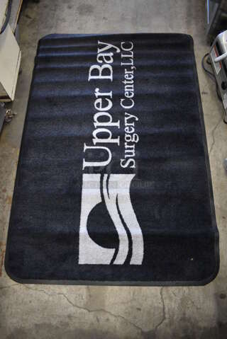 Black Floor Rug w/ Upper Bay Surgery Center Logo. 67x44