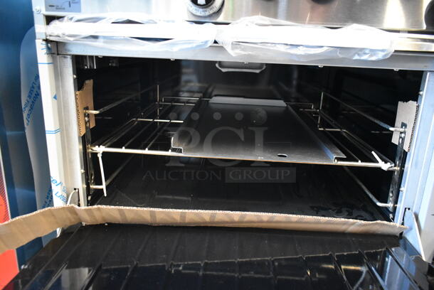 BRAND NEW SCRATCH AND DENT! Garland G60-4G36RR Stainless Steel Commercial Natural Gas Powered 4 Burner Range w/ Flat Top, 2 Ovens, Over Shelf and Back Splash.  - Image 8 of 10