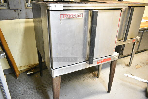 Blodgett Mark V Stainless Steel Commercial Electric Powered Full Size Convection Oven w/ Solid Doors, Metal Oven Racks and Thermostatic Controls on Metal Legs. This Unit Was In Working Condition When the Restaurant Closed. (kitchen) - Image 6 of 9