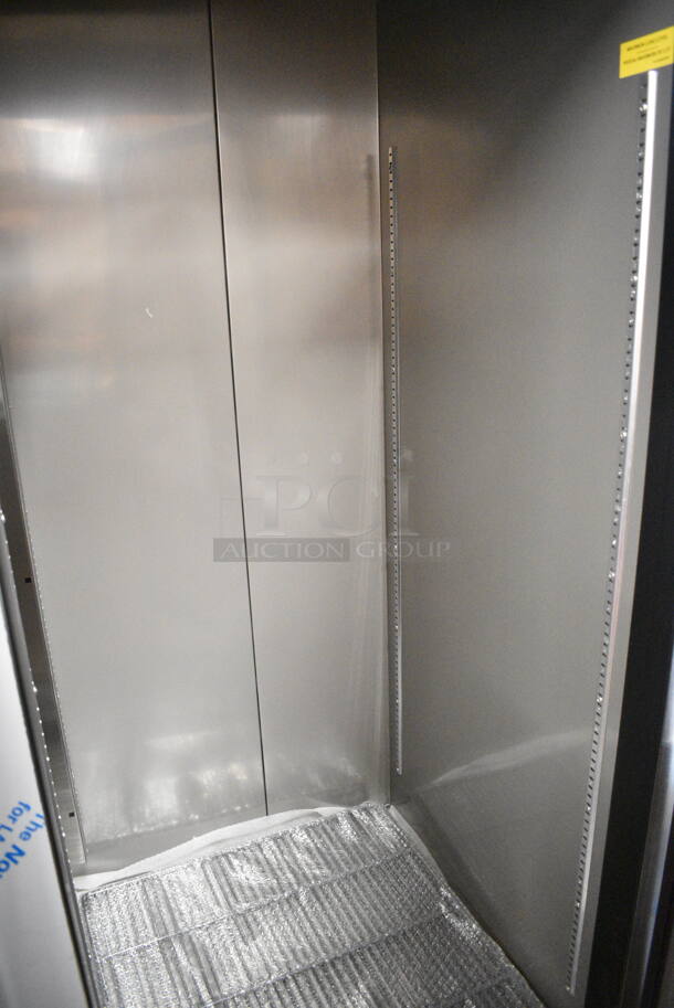 BRAND NEW SCRATCH AND DENT! 2023 Avantco 447AP49F Stainless Steel Commercial 55 3/8" Stainless Steel Solid Door Reach-In Freezer w/ Poly Coated Racks. 115 Volts, 1 Phase. Tested and Working! - Image 4 of 7