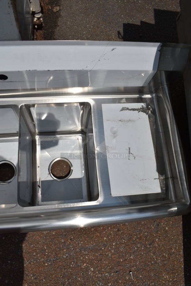 BRAND NEW SCRATCH AND DENT! Steelton 522CS31014LR Stainless Steel 54" 18-Gauge Stainless Steel Three Compartment Commercial Sink with 2 Drainboards - 10" x 14" x 12" Bowls. No Legs.  - Image 4 of 7