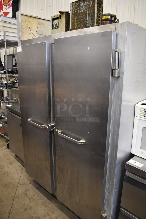 Continental 2F Stainless Steel Commercial 2 Door Reach In Freezer w/ Poly Coated Racks on Commercial Casters. 115 Volts, 1 Phase. 52x34x82. Tested and Powers On But Does Not Get Cold - Image 1 of 6