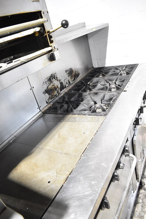 Southbend Stainless Steel Commercial Natural Gas Powered 6 Burner Range w/ Flat Top Griddle, 2 Ovens, Cheese Melter and Back Splash on Commercial Casters.  - Image 5 of 9