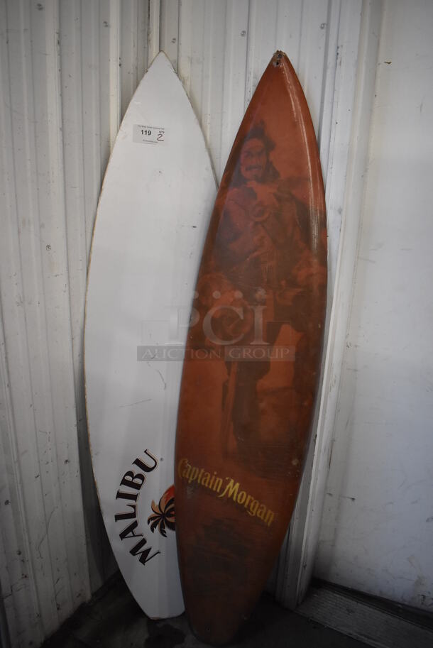 2 Decorative Surfboards; Captain Morgan and Malibu. 16x2x71, 18x1x72. 2 Times Your Bid!