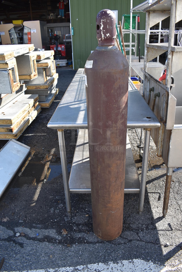 Metal Compressed Gas Tank. Buyer Must Pick Up - We Will Not Ship This Item. 9x9x60