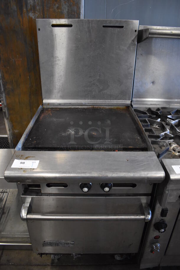 American Range Stainless Steel Commercial Natural Gas Powered Flat Top Griddle w/ Oven and Back Splash on Commercial Casters. 24x33x57